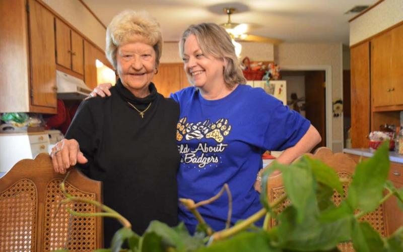 Treva Clark and daughter, Melanie Brooks, share family stories with the ivy plant that has been in the family for decades. MONIQUE BRAND | DISPATCH RECORD