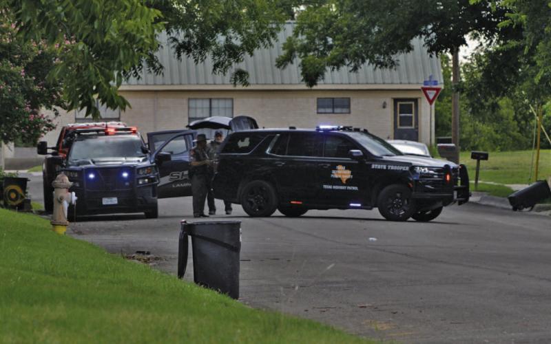 Texas Department of Public Safety vehicles park on West Avenue A near Arnold Street during a standoff with a perpetrator responsible for shooting two Lampasas women, then later himself, on Thursday. ERICK MITCHELL | DISPATCH RECORD