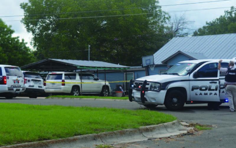 Local law enforcement agencies helped evacuate the area around North Arnold Street while negotiators tried to make contact with the shooter, who barricaded himself in his residence. ERICK MITCHELL | DISPATCH RECORD
