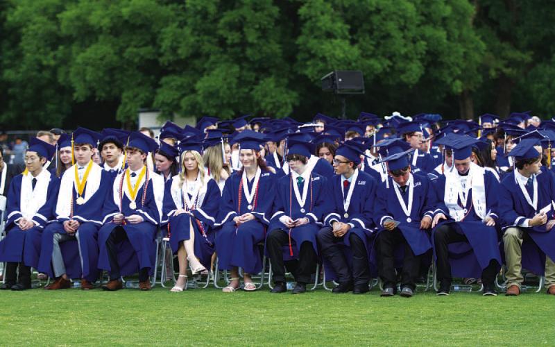 HUNTER KING | DISPATCH RECORD Lampasas High School seniors wait to receive their diplomas after being introduced at last week’s ceremony.