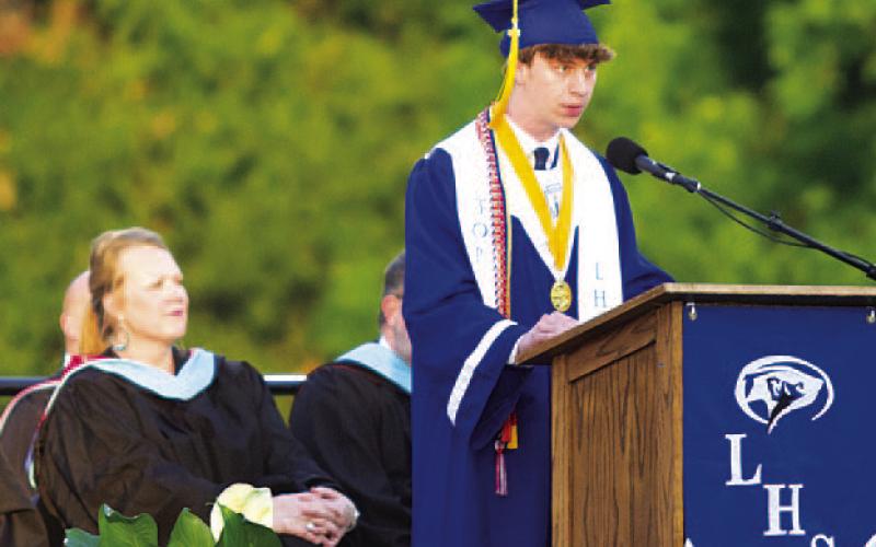 Valedictorian Cale Wheeler speaks to the Class of 2026 at graduation on Friday. HUNTER KING | DISPATCH RECORD