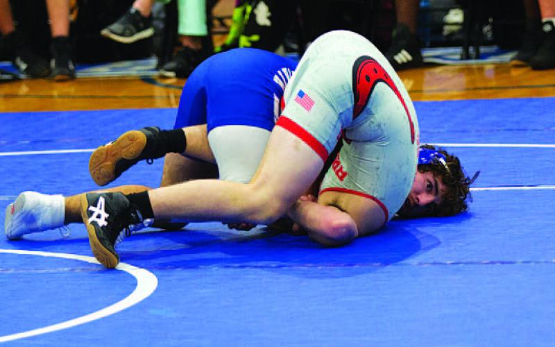 FILE PHOTO Both Taylor Martell, left, and Daemian Rivas were the district wrestling champions, and they will look to have similar success at the regional meet on Friday in Addison.