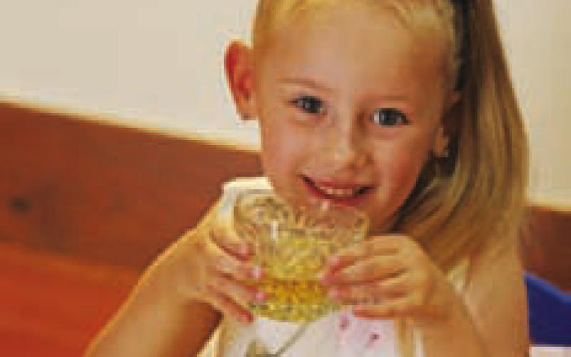Five-year-old Reagan Groves sips her apple juice “tea” while she enjoys socializing at the Teddy Bear Tea. JOYCESARAH MCCABE | DISPATCH RECORD