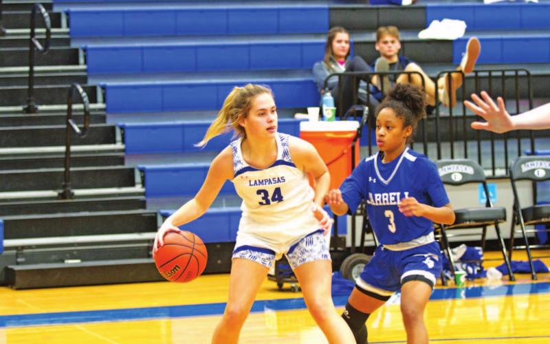 Jamie Ball dribbles and looks for a teammate during a previous game against Jarrell. HUNTER KING | DISPATCH RECORD