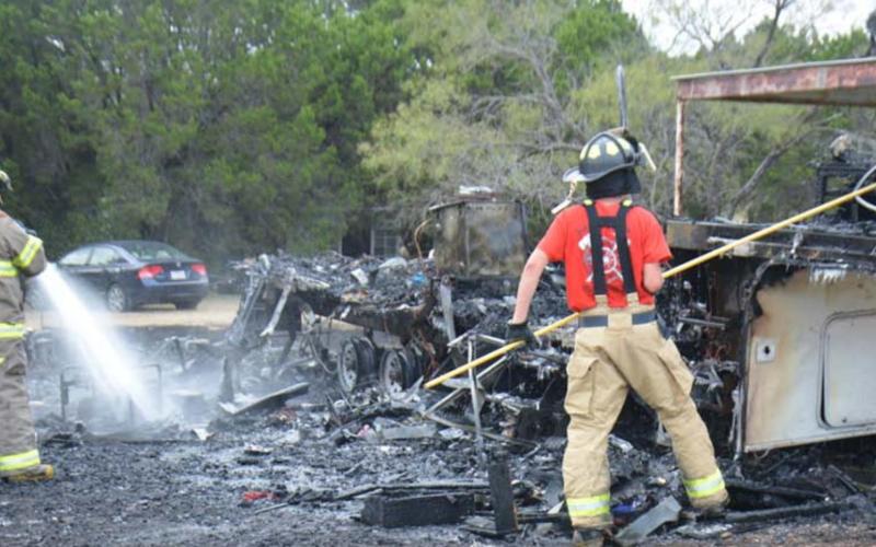 Members of the Kempner Volunteer Fire Department cleared out a camper that was engulfed in flames for close to 30 minutes Tuesday afternoon. No injuries were reported. MONIQUE BRAND | DISPATCH RECORD