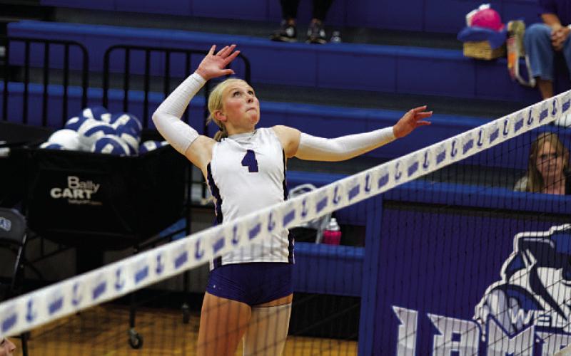 HUNTER KING | DISPATCH RECORD Brylie Turner leaps through the air for a spike during Tuesday’s match against the Lady Eagles.