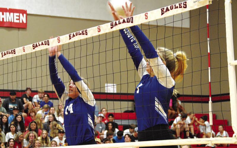 HUNTER KING | DISPATCH RECORD Avery Bolm, left, and Madison Roedler go up for a block during the second set of the Lady Badgers’ contest in Salado.