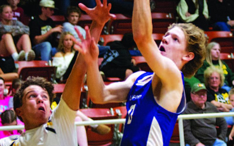 HUNTER KING | DISPATCH RECORD Peyton Sisson finishes through some contact during Tuesday night’s contest.
