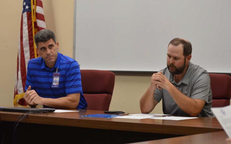 Lampasas ISD Superintendent Dr. Chane Rascoe, left, and Board of Trustees President Ryan Shahan reflect on budget considerations at a recent school board meeting. Erick Mitchell | Dispatch Record
