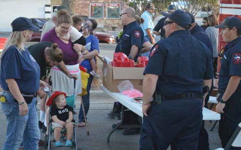 Families were eager to visit the Lampasas Fire Department’s booth to snag a novelty fire hat for their little ones. Erick Mitchell | dispatch record