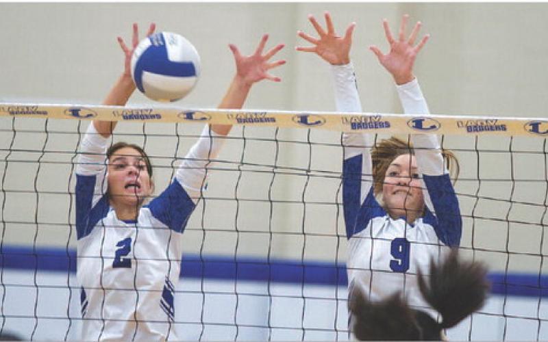 Landry White, left, and Lilee Hamill execute a block against Waco Connally. HUNTER KING | DISPATCH RECORD