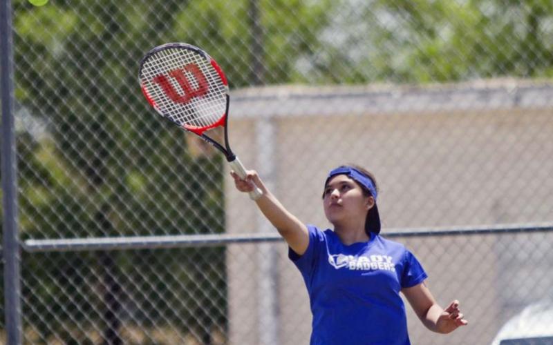 Mia Bazaldua, pictured above, and Tyler Wells won consolation finals in seventh-grade doubles at the LMS tennis tournament on Saturday. JEFF LOWE | DISPATCH RECORD