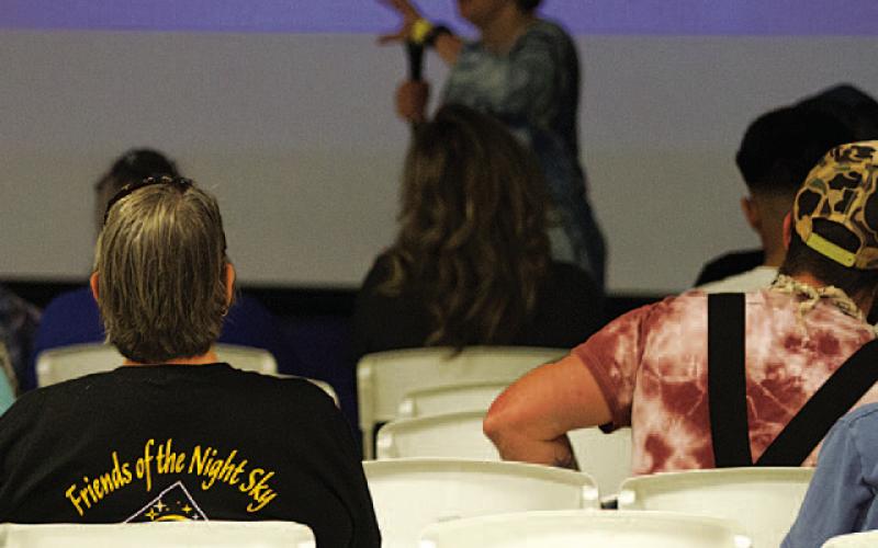 Local residents listen in as Deborah Moran speaks to the crowd at last Saturday’s “The Stars at Night” event hosted by the Friends of the Night Sky. HUNTER KING | DISPATCH RECORD