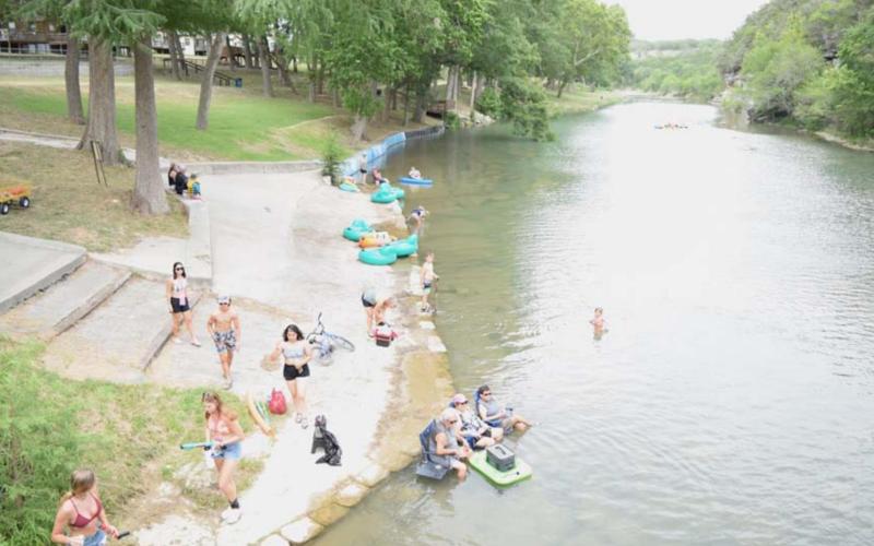 Families enjoy a float down the Guadalupe River on a hot summer day. Tubing, swimming and kayaking are all outdoor activities that families can enjoy together and require a little bit of exercise. |ALEXANDRIA RANDOLPH | DISPATCH RECORD