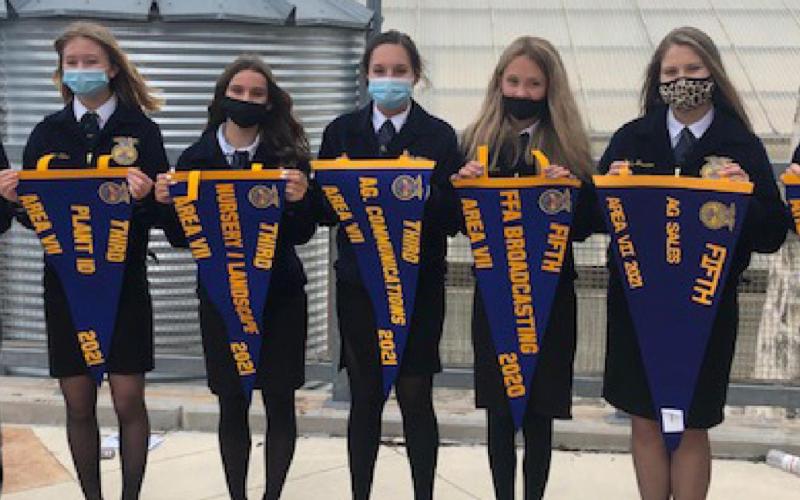 Students display winnings from the 2020-2021 competition yea