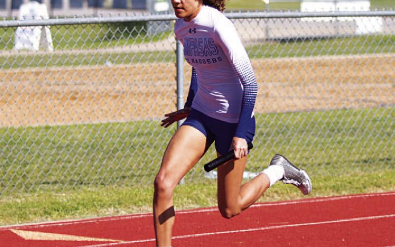 HUNTER KING | DISPATCH RECORD Aubrey Spellman competes in multiple relay races for the Lady Badgers.