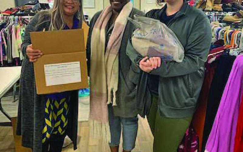 JoAnn Mensch, at left, Shavonne McClendon and Lilian Stephen pause for a photo inside the New Beginning of Restoration Beginning and Hope location. COURTESY PHOTO
