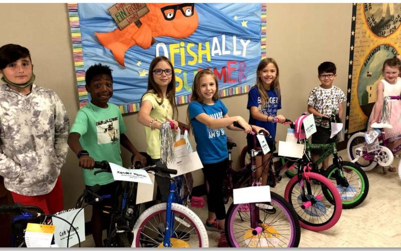 Second-semester and all-year Perfect Attendance Award recipients had their names entered into a drawing for a bicycle. Bicycle winners, pictured left to right, are Colt Wilson, Alexander Martin, Allie Weinheimer, Amy Weinheimer, Taylor Creek, Alex Torrez, Kylie Davis and Kayleigh Harper. COURTESY PHOTO