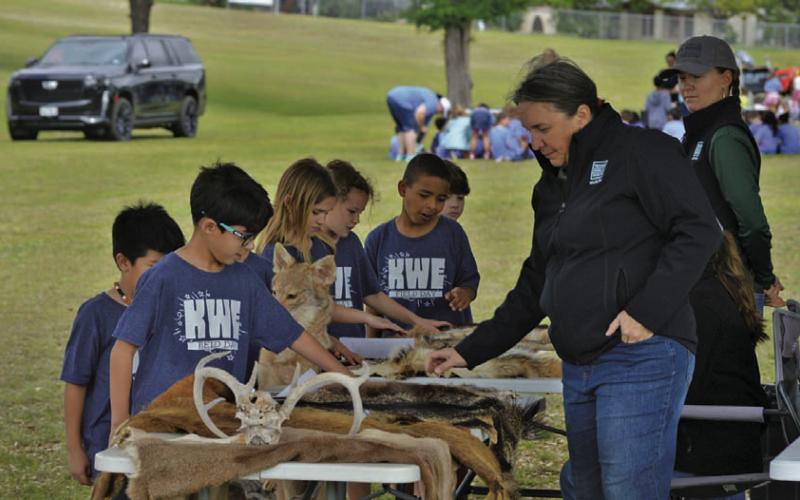 ERICK MITCHELL | DISPATCH RECORD Kline Whitis Elementary School students get up close and personal with animal hides after an instructional session with Texas Parks and Wildlife biologists.