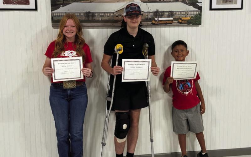 From left to right are Selie Hodge, James Horrell and Rolanzo Almaguer, who were recognized as students of the month at this week’s Lometa school board meeting. Kylie Pauly (not pictured) was named staff member of the month. COURTESY PHOTO