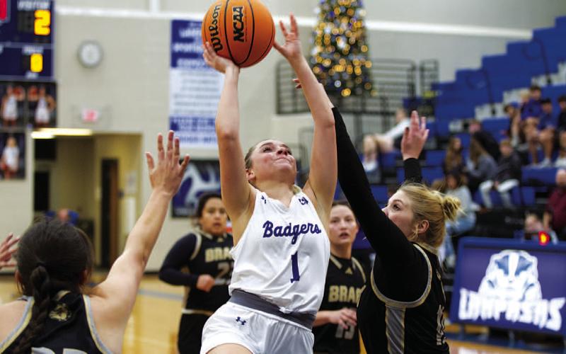 HUNTER KING | DISPATCH RECORD Abra White scored 10 points and had five assists in the game against the Lady Bulldogs.