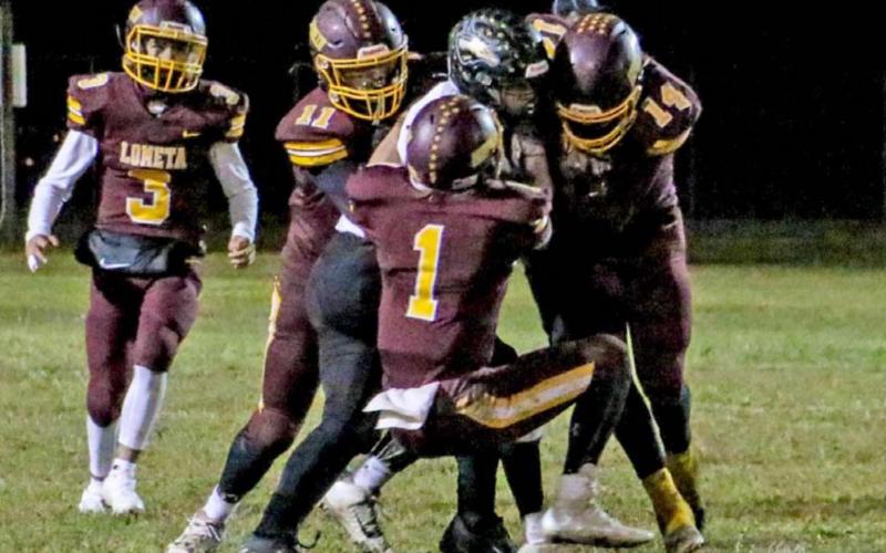 Luis Acevedo (14), Lane Evans (1), DJ Smart (11) and Alonso Caso (3) converge for a defensive stop against Evant. Lometa reached the playoffs for the first time since 2017 and beat the rival Elks for the first time since 2014. MEGAN LUSTY | DISPATCH RECORD