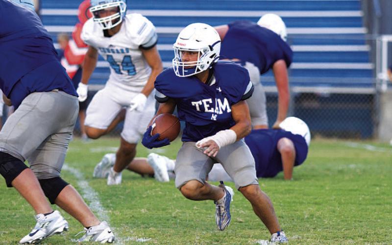 HUNTER KING | DISPATCH RECORD KJ Reed is expected to take a handful of the running back touches in 2024.