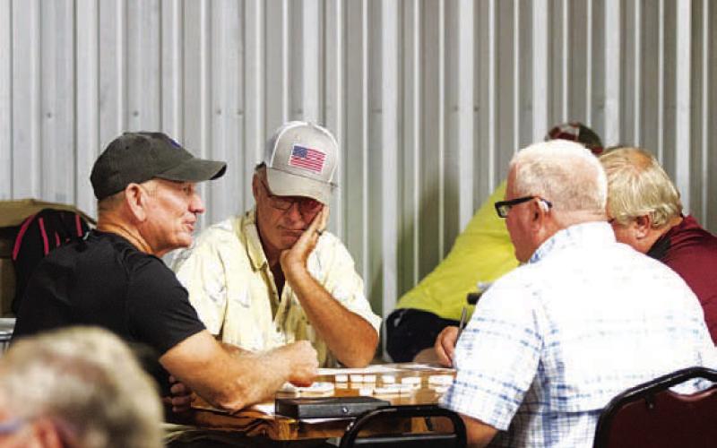 A group of meen sit down to start their game during the 42 tournament on the Tuesday of Spring Ho. There were likely around 40 teams that played in the competition. HUNTER KING | DISPATCH RECORD