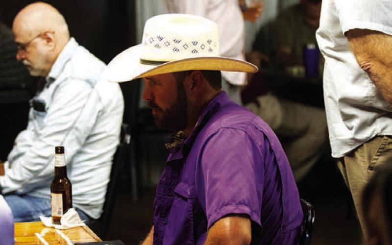 Ryan Shahan thinks about his next move early in a game. The current school board president was one of many that made it out to Putters and Gutters for the event. HUNTER KING | DISPATCH RECORD