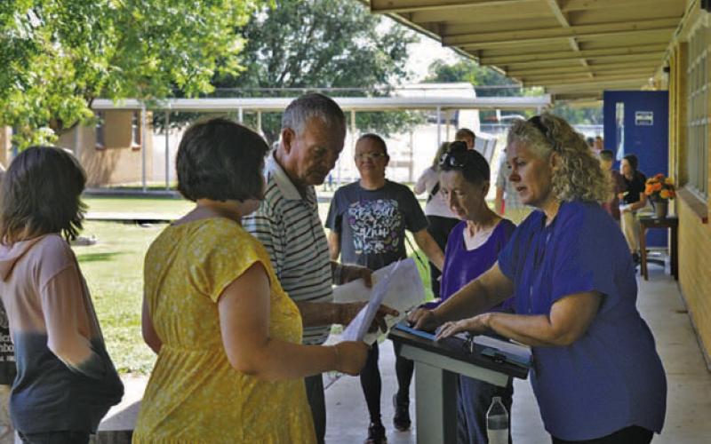 LMS English/language arts teacher Andrea Haas greets parents and students during the campus’ Meet the Teacher event. ERICK MITCHELL | DISPATCH RECORD