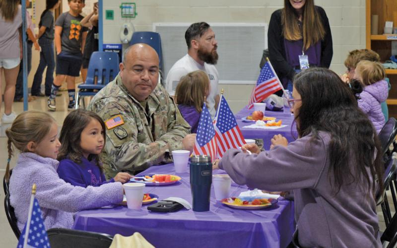 Hanna Springs students and their military family members enjoy a special breakfast Friday at the elementary school. erick mitchell | dispatch record