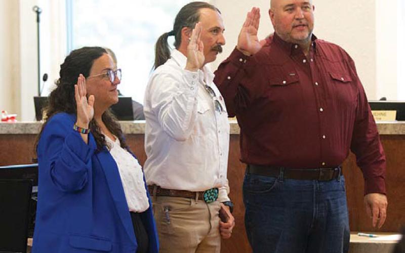 Council members Cathy Kuehne, Zac Morris (center) and Davis Keele took their oaths of office Monday night after votes from the May 2 municipal election were canvassed and accepted. hunter king | dispatch Record