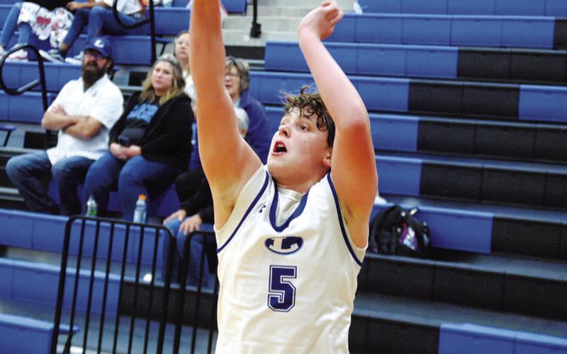 Aidan Nuckles lets fly one of his five successful threes in Tuesday’s game against Eastside Memorial. HUNTER KING | DISPATCH RECORD
