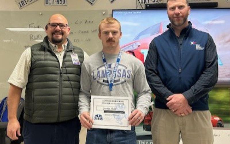 Justin Reid, center, was named a Staff of the Month honoree for January. A former Lampasas High School graduate, Reid now is an automotive program instructor. On hand to congratulate him are Assistant Principal Ryan Race, at left, and Clay Phillips of Texas Farm Bureau Insurance. courtesy photo