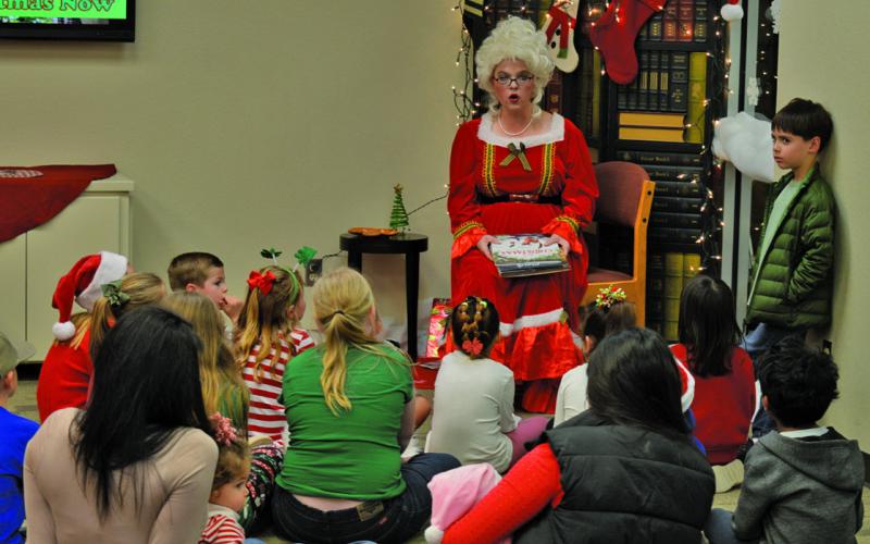 Mrs. Claus spent time reading books to children at the Lampasas Public Library. ERICK MITCHELL | DISPATCH RECORD