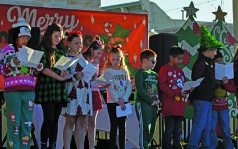 Lampasas ISD elementary school students brought Christmas carols to the downtown square. ERICK MITCHELL | DISPATCH RECORD