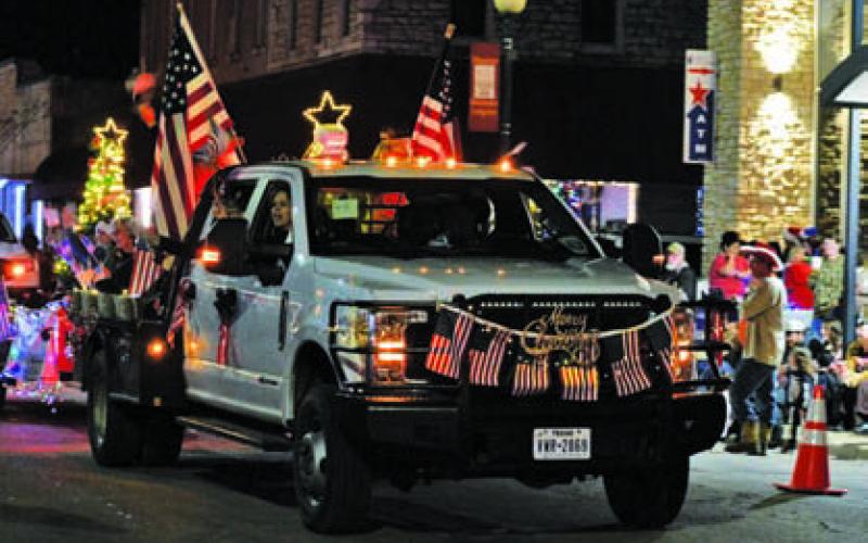 ERICK MITCHELL | DISPATCH RECORD The Texas First Conservative Alliance float brought a big splash of red, white and blue to Saturday’s lighted parade.