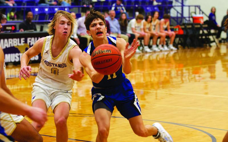 Luke Shivers kicks the ball out to Ethan Moreno during the contest last week. HUNTER KING | DISPATCH RECORD