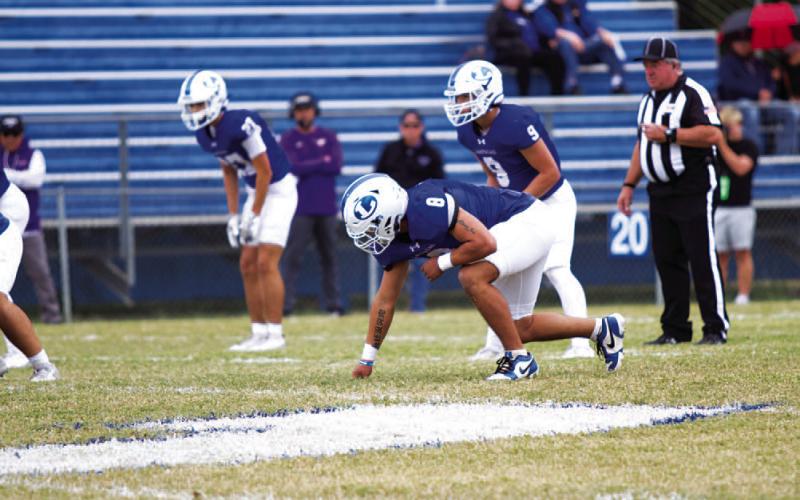Elias Ayala lines up ready to rush the passer during last Saturday’s game against Marble Falls. HUNTER KING | DISPATCH RECORD