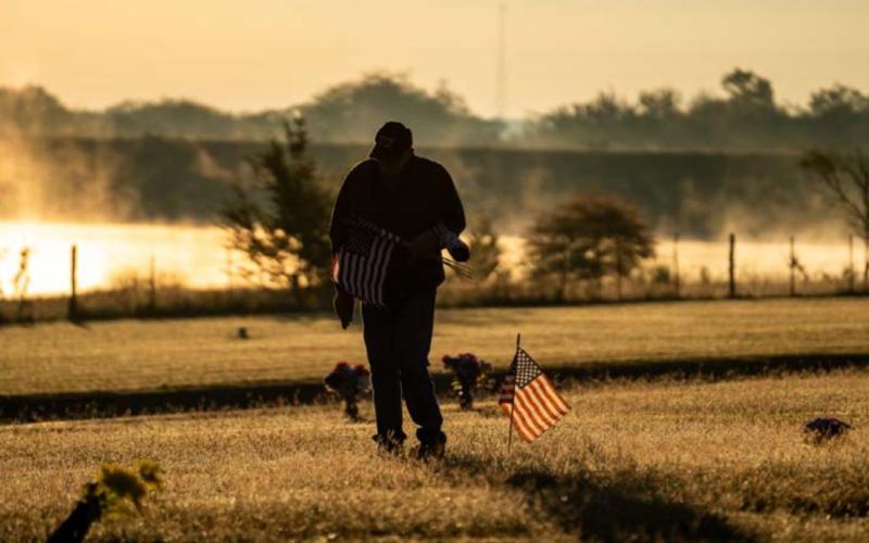 Memorial flags placed at cemetery