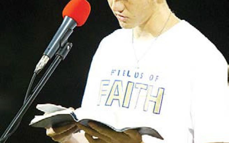 hunter king | Ldispatch record Lampasas High School senior Keaton Black reads a passage from the Bible before introducing his father, Kyle Black, to speak.
