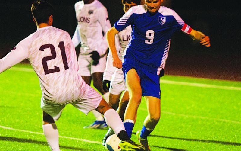 HUNTER KING | DISPATCH RECORD Keaton Black fights for possession of the ball against Brownwood in the Badgers’ district opener.
