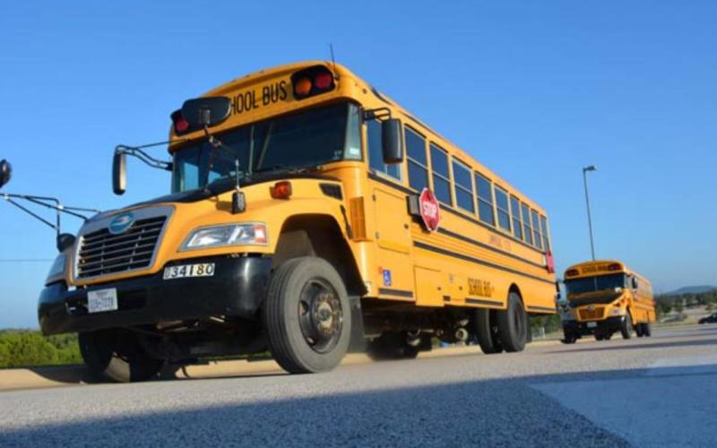 School buses line up outside Taylor Creek Elementary School on Thursday morning -- the first day of classes. MONIQUE BRAND | DISPATCH RECORD
