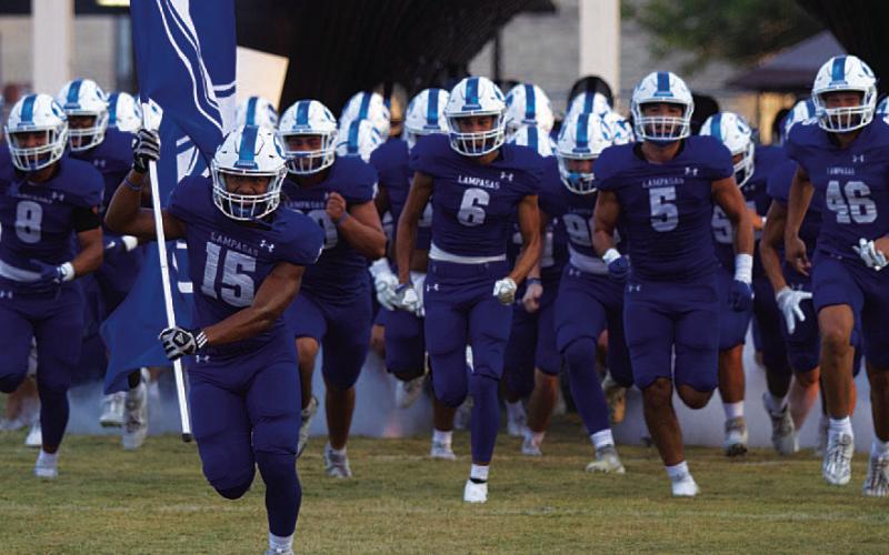 The Badgers break out of the tunnel for their season-opener against Elgin last week. HUNTER KING | DISPATCH RECORD