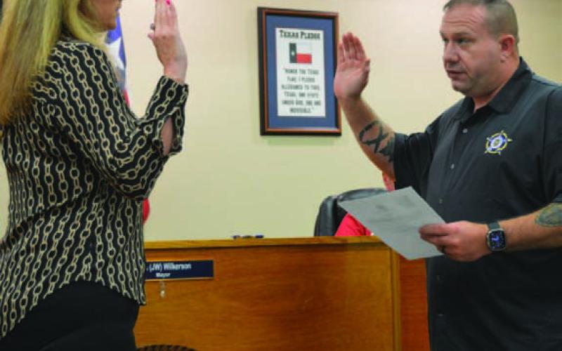 ERICK MITCHELL | DISPATCH RECORD At right, Kempner Mayor John Wilkerson administers the oath of office for new Court Clerk/Assistant City Secretary Rebecca Ramos. Kempner City Council members discussed staffing changes during Tuesday’s budget workshop.