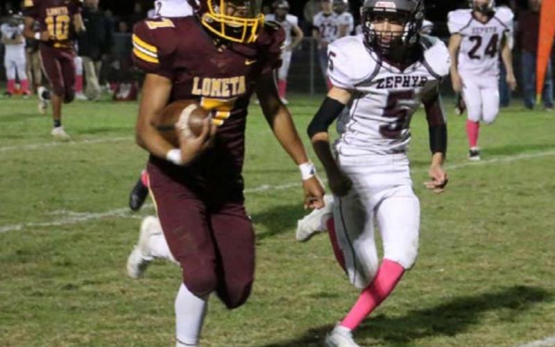 Leonel Caso runs away from a Zephyr defender during Lometa’s homecoming game earlier this year. MEGAN LUSTY| DISPATCH RECORD