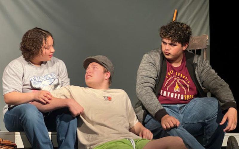COURTESY PHOTOS Sholee Turner, Jacob Wooten and Lamar Linton, left to right, run lines during a practice on set. Lometa will compete in the district One-Act Play contest on Monday in Lometa.