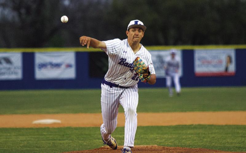 Calvin Phelps releases a pitch during the first inning of last Friday’s contest. HUNTER KING | DISPATCH RECORD