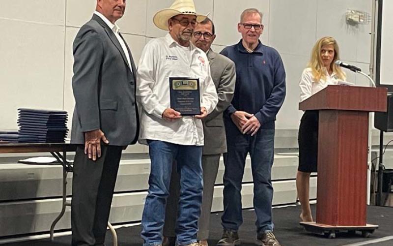 Adamsville Volunteer Fire Department Chief Dean Watson, holding plaque, was named First Responder of the Year for his entity by the Hill Country 100 Club. The club held its banquet March 7 to recognize area first responders. sharon watson | courtesy photo