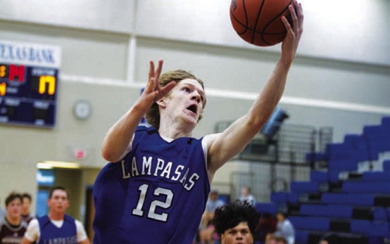 HUNTER KING | DISPATCH RECORD Peyton Sisson goes up to finish a layup during the scrimmages.